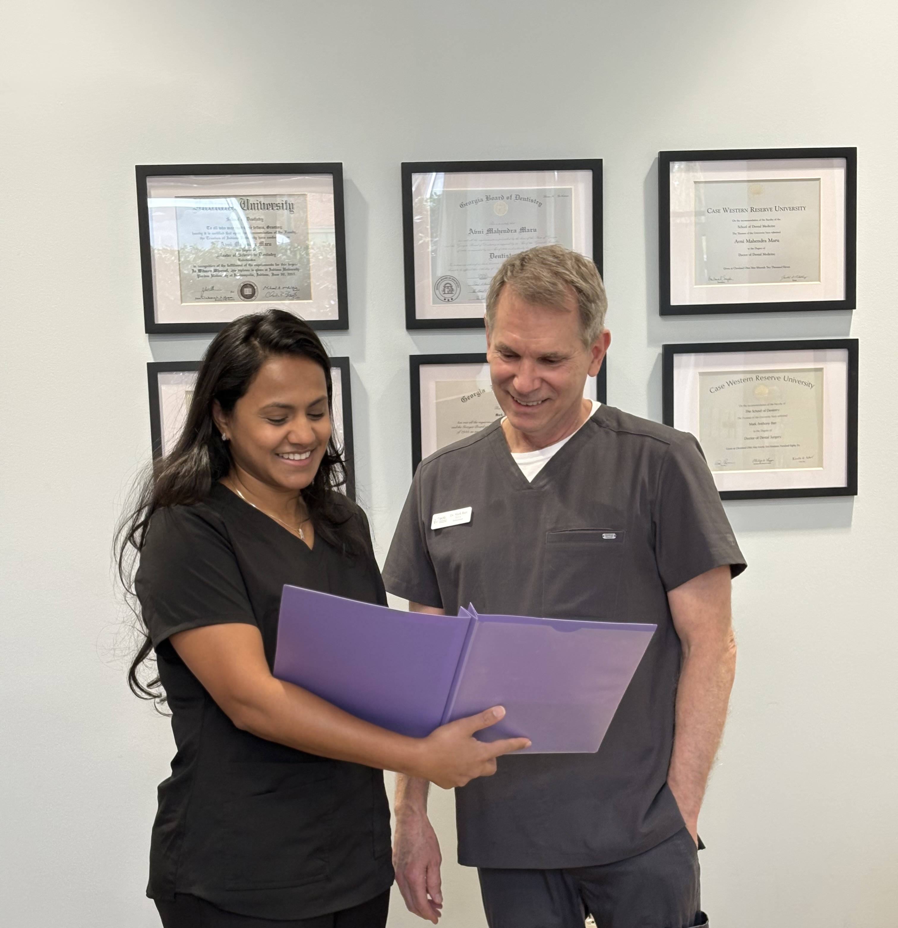 Dr. Maru and Dr. Barr reviewing patient records